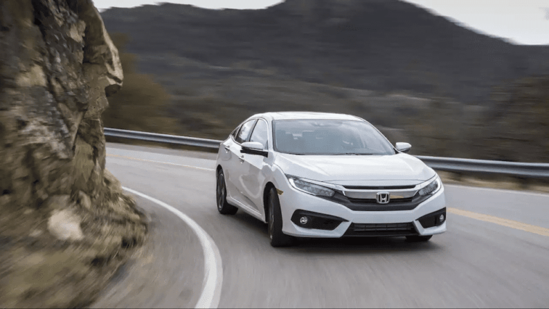 2017 White Honda Civic Driving On Mountain