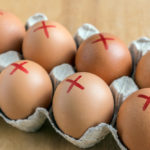 Eggs marked with a red ex to represent recall.