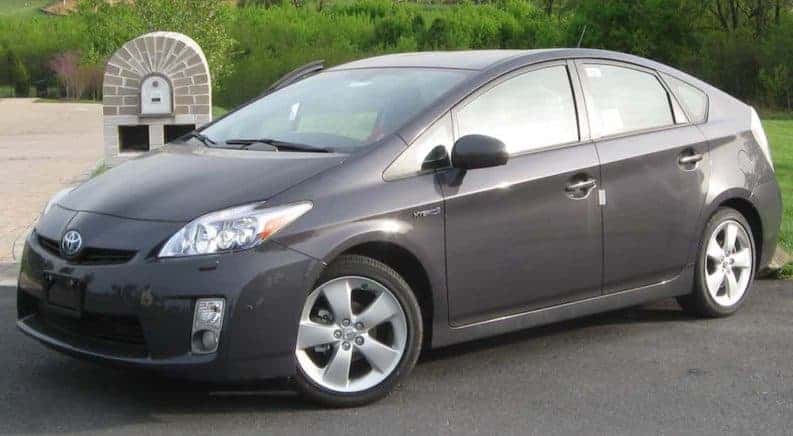 Grey 2010 Toyota Prius in front of mailbox and hedge