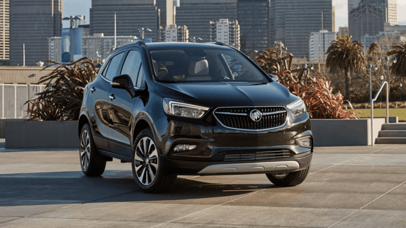 Black 2019 Buick Encore in front of city park