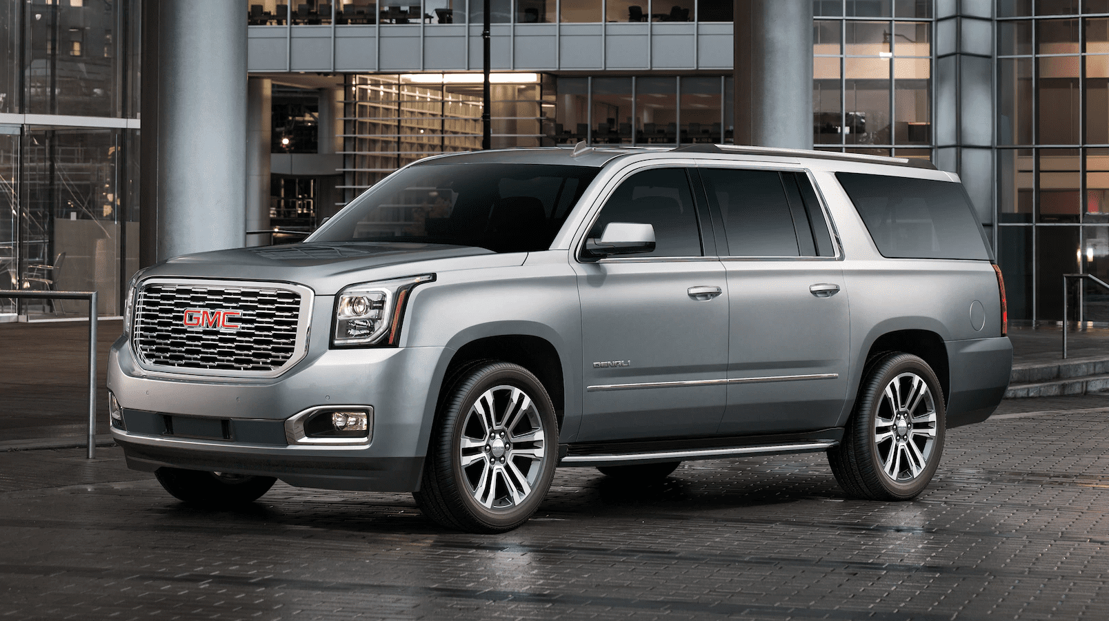 Silver 2019 GMC Yukon XL in front of Office building