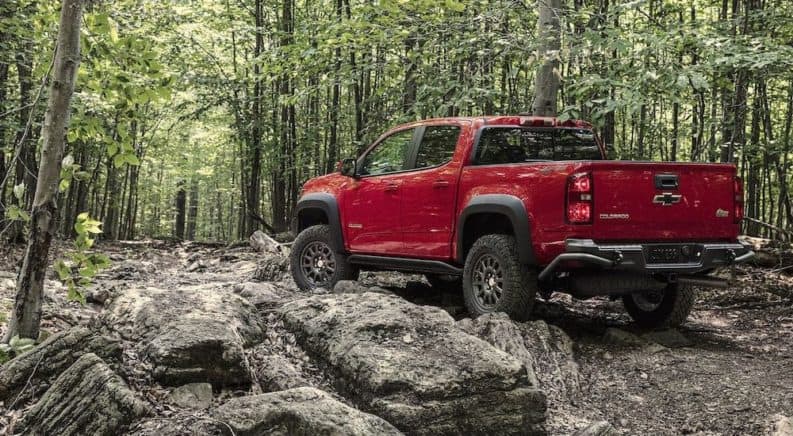 a red 2019 Chevy Colorado navigates a rocky trail