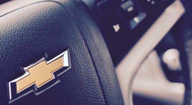Closeup of Chevy logo on steering wheel