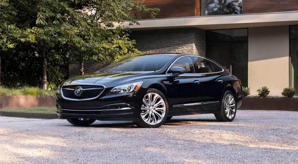 Black 2019 Buick Lacrosse in front of mansion