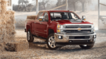 Red 2019 Silverado HD in barn with stacks of hay