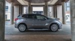 A gray 2019 Buick Envision under a fancy entry way