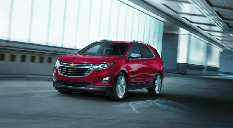 A red 2019 Chevy Equinox driving in a tunnel