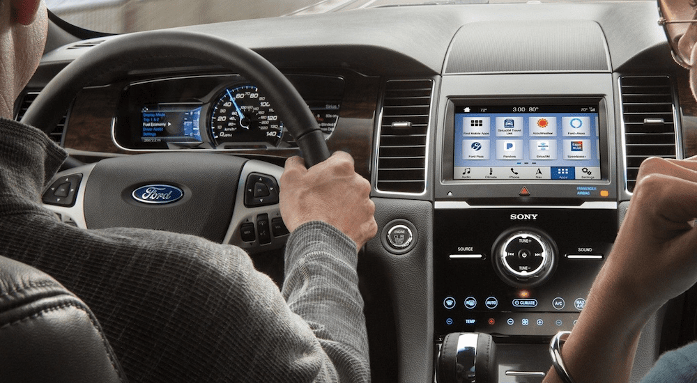 Two people inside the tech-heavy 2019 Ford Taurus