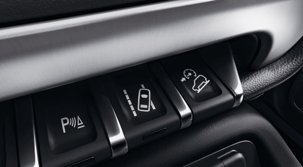 A closeup of the towing control buttons on a 2019 GMC Sierra 3500HD