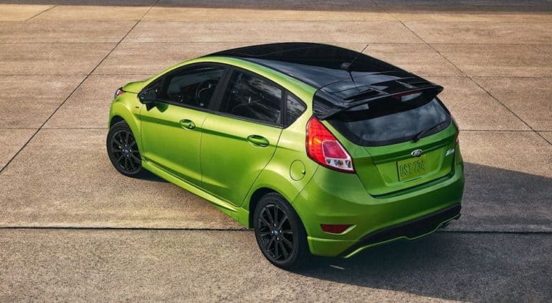 A bright green 2019 Ford Fiesta parked at an angle in a parking lot