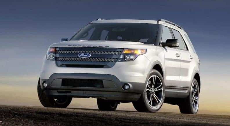 A used white 2015 Ford Explorer from a local dealership