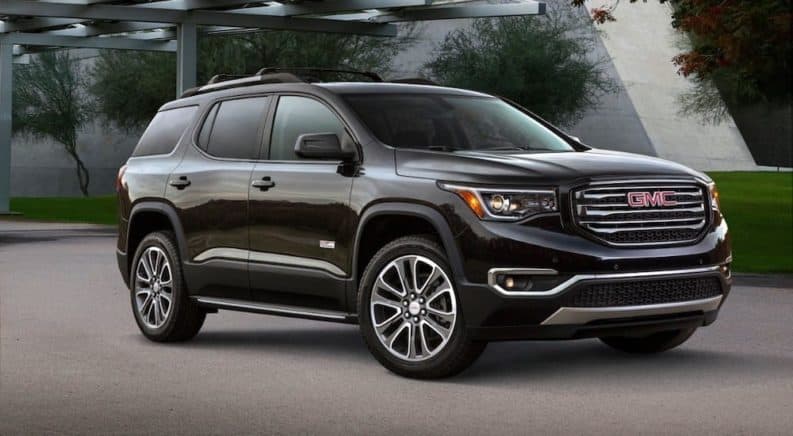 A black 2019 GMC Acadia All Terrain sits victorious of the 2019 GMC Acadia vs 2019 Chevy Traverse