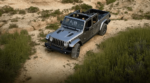 A gray 2020 Jeep Gladiator treks from above through the desert with the top down