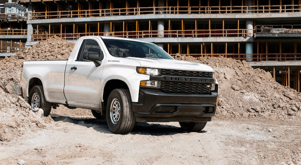 A White 2019 Chevy 1500 is shown on a construction site.