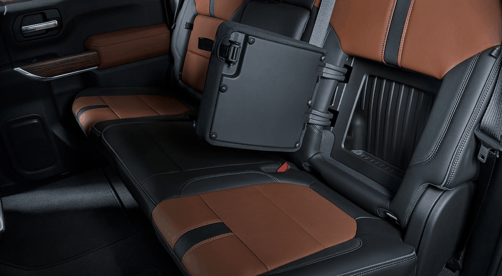 The brown and black interior of the 2019 Chevy Silverado has in seat storage compartments and plays a factor in the 2019 Chevy Silverado vs. 2019 Ford F-150 comparison.