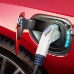 A red 2017 Ford Focus Electric's plug area is shown.