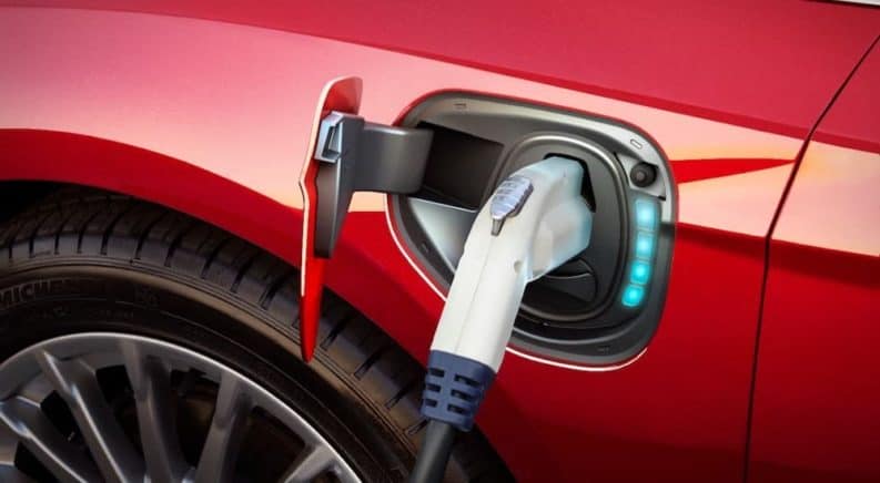 A red 2017 Ford Focus Electric's plug area is shown.