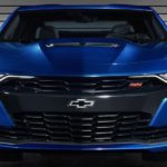 The front end of a blue 2019 Chevy Camaro is shown.