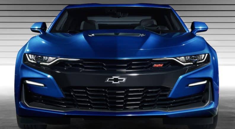 The front end of a blue 2019 Chevy Camaro is shown.