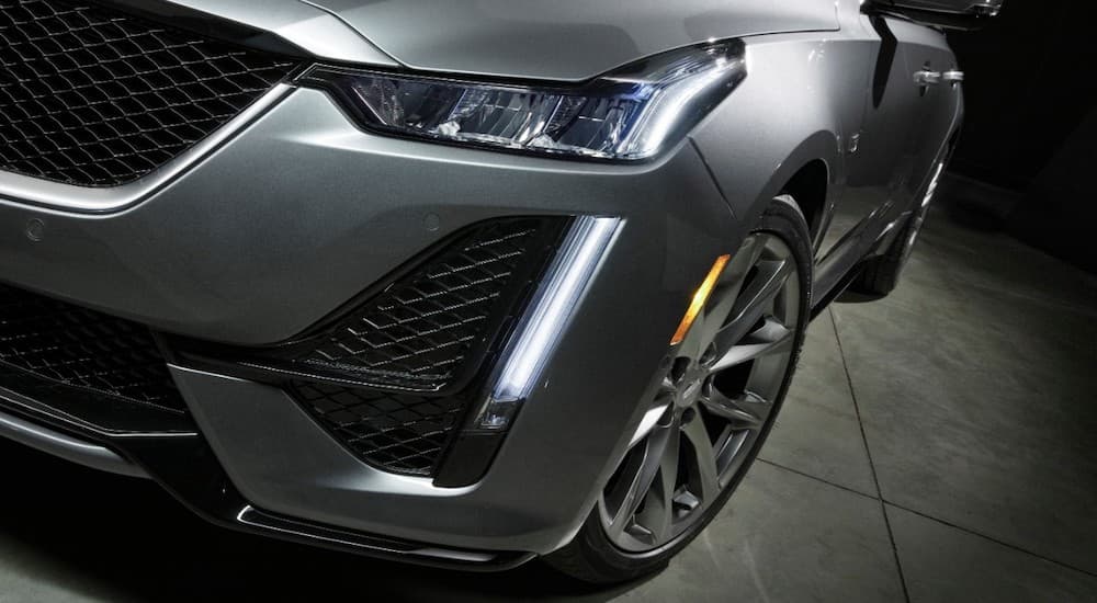 A grey 2020 Cadillac CT5 Sport is shown in a closeup of the front drivers side angle.