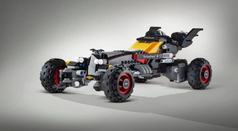 The Chevy Lego Batmobile is shown on a white and grey backdrop.