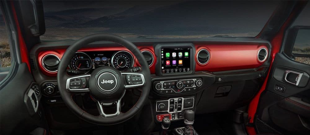 An interior shot of the brand new 2020 Jeep Gladiator, red and black are the main colors. 