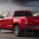 A red 2019 GMC Canyon is shown at a rear angle.