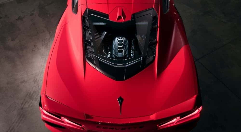 The engine bay is shown from above on a red 2020 Chevy Corvette.