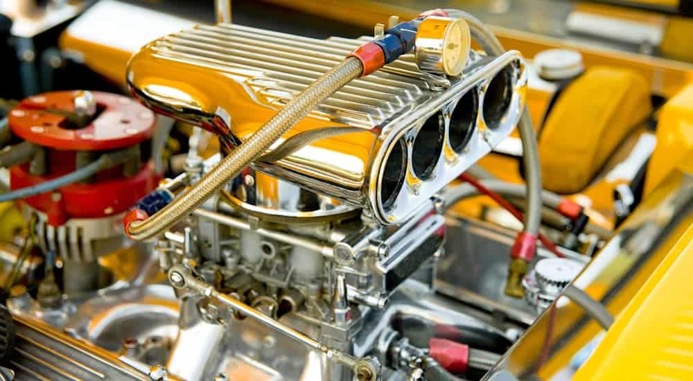 The chrome pieces of a hot rod engine bay are shown.