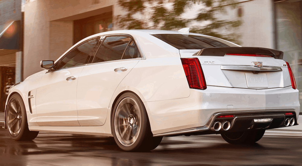 A white 2019 Cadillac CTS-V is in front of a store after leaving a Cadillac dealer near me.
