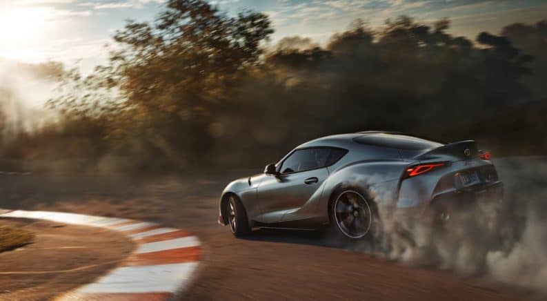 In current auto news the 2020 Toyota GR Supra is being released, shown here on a track in grey.