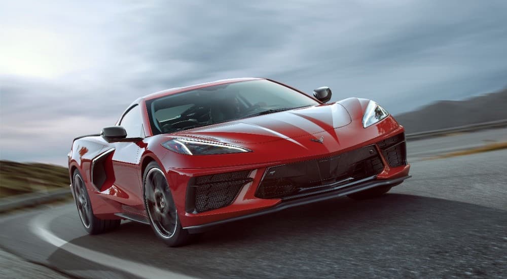 A red 2020 Chevy Corvette is driving on a track.