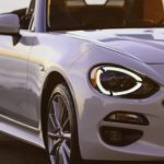 A close up of a white 2019 Fiat 124 Spider.