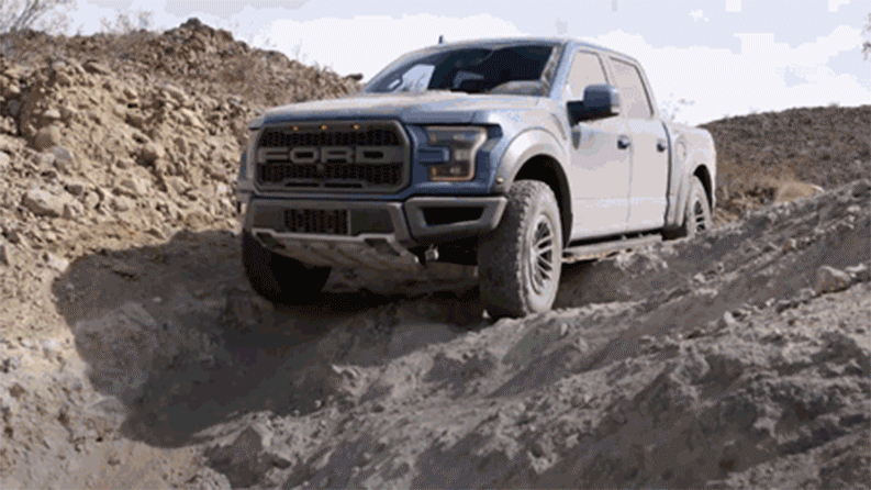 A blue 2019 Ford Raptor is shown using off-road features in a short video