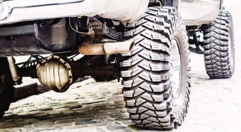 A close up of a lifted truck's suspension.