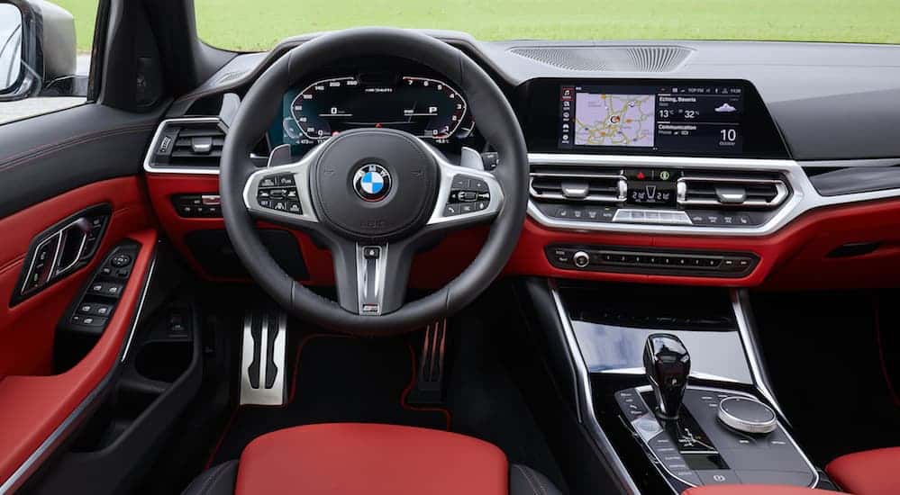 The infotainment system in a BMW M340i xDrive Touring, which is popular among infotainment systems when you search used car dealership near me.