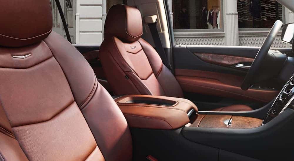 The red leather front interior that you'll find in a 2020 Cadillac Escalade is shown.