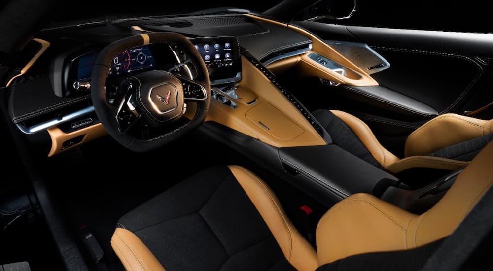 The black and tan interior of the 2020 Chevy Corvette is shown.
