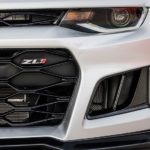 The front end of a white 2017 Chevy Camaro is shown.