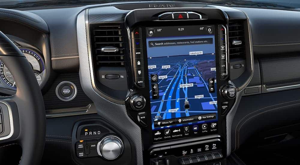 A close up of the front black interior of the 2019 Ram 2500 is shown with a 12.5 inch touchscreen. 