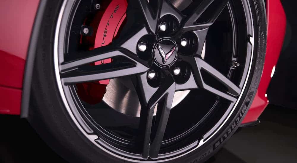 A close up of a 2020 Chevy Corvette's tire on a black wheel are shown.