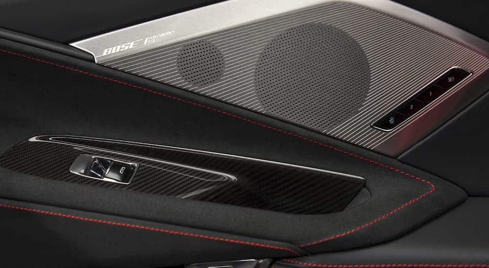 A silver Bose speakers Performance Series cover inside a 2020 Chevy Corvette.
