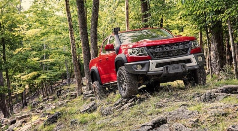 A red 2020 Chevy Colorado ZR2 Bison is off-roading after leaving a Chevy dealer near me.