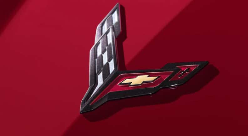 A close up of the 2020 Chevy Corvette logo is shown.