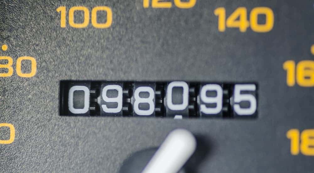 A close up view of a car's mileage is shown. 