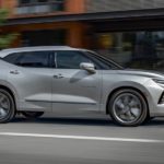 A silver 2020 Chevy Blazer is driving on a city street after winning the 2020 Chevy Blazer vs 2020 Ford Edge comparison.