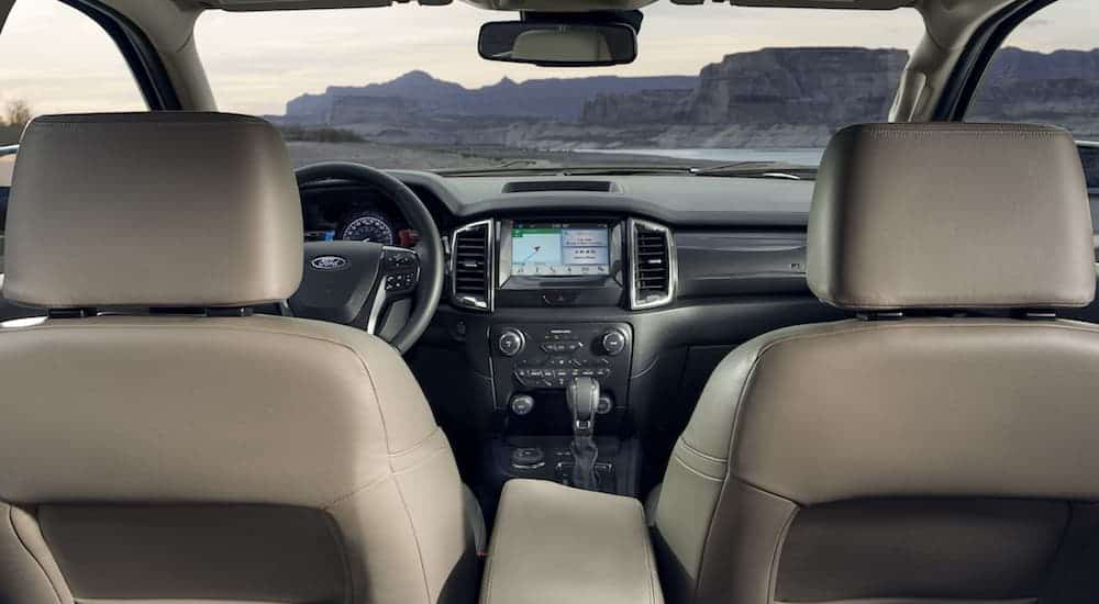 The front grey and tan interior of a 2020 Ford Ranger is shown. 