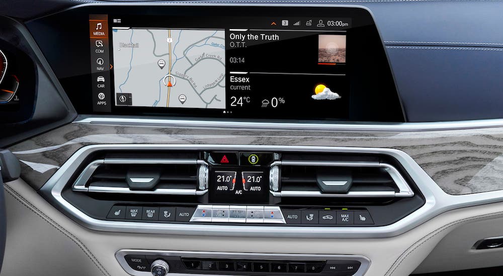 The luxurious infotainment screen and dashboard are shown in a 2020 BMW X7.