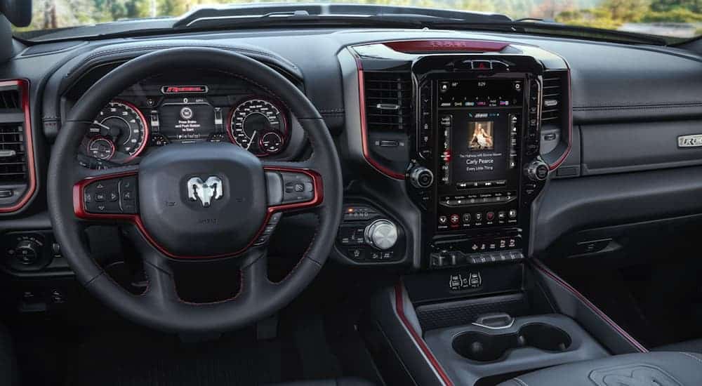 The black and red infotainment features of the 2020 Ram 1500 is shown.