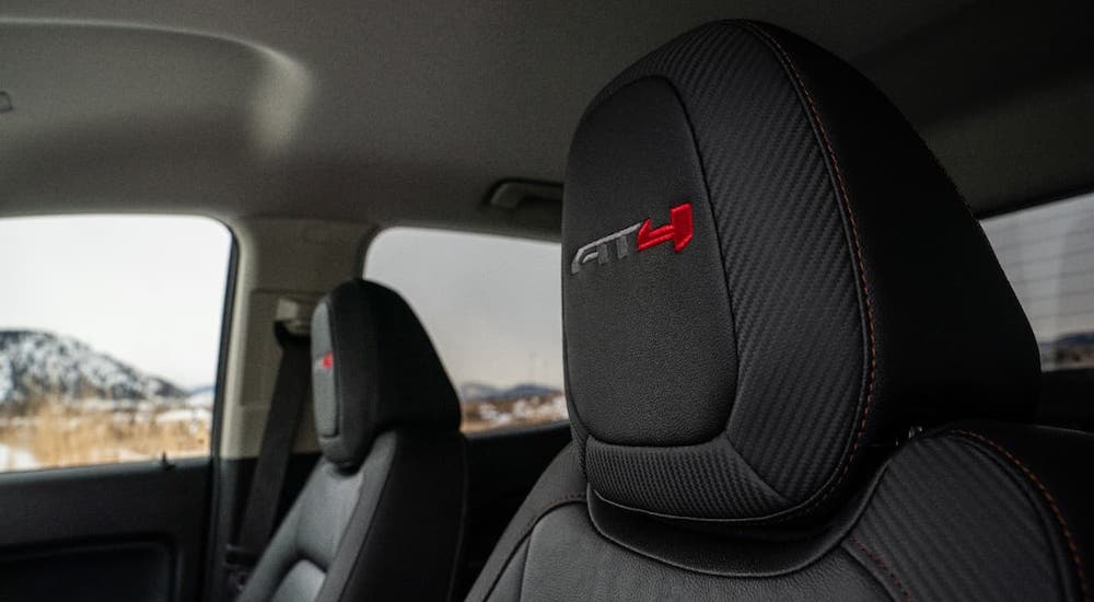 A closeup is shown of the embroidered headrest of a 2021 GMC Canyon AT4.